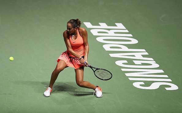 SINGAPORE - OCTOBER 25: Madison Keys of the United States plays a backhand in her singles match against Dominika Cibulkova of Slovakia during day 3 of the BNP Paribas WTA Finals Singapore at Singapore Sports Hub on October 25, 2016 in Singapore. (Photo by Julian Finney/Getty Images)